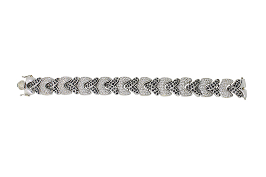 1 BRACCIALE IN O.B. 18 KR. CHE INCASTONA BRILLANTI PER COMPL. KT. 2,70 C.a E BRILLANTI NERI PER COMPL. KT. 2,00 C.a GR. 55,00