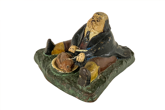 1 CALAMAIO IN METALLO RAFFIGURANTE “DANIEL LAMBERT” (INSERTO IN VETRO MANCANTE) DIM. 17x13x17 CM