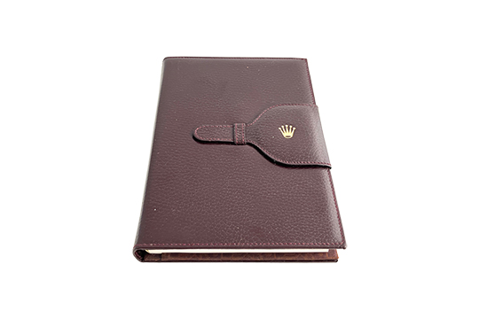 1 PORTABLOCCO PER APPUNTI IN PELLE, COLORE MARRONE SCURO CON LOGO ROLEX DORATO DIM. 14x20 CM