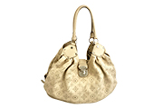 1 BORSA LOUIS VUITTON SURYA MAHINA GM IN PELLE COLORE BEIGE, MONOGRAMMA TRAFORATO, DETTAGLI IN METALLO COLORE ARGENTO, DOPPI MANICI, PORTABILITÀ MANO E A SPALLA, FORNITA DI CERTIFICATO DI AUTENTICITÀ ENTRUPY DIM. 35x16x25 CM