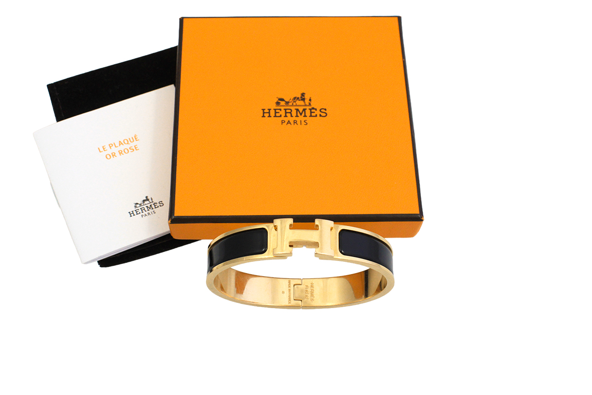 1 BRACCIALE FIRMATO HERMÈS “CLIC H” IN METALLO PLACCATO ORO ROSA E SMALTO NERO, (MISURA 17 CM) FORNITO DI SCATOLA ORIGINALE